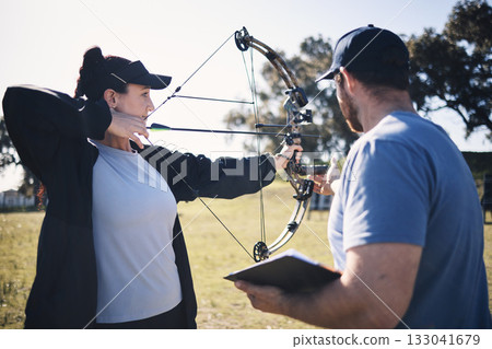 Archery, bow and arrow with woman and coach, aim at target with sports outdoor, combat training and weapon. Coaching, learning and teaching with female and man at shooting range, archer and help Archery, bow and arrow with woman and coach, aim at target with sports outdoor, combat training and weapon. Coaching, learning and teaching with female and man at shooting range, archer and help 133041679