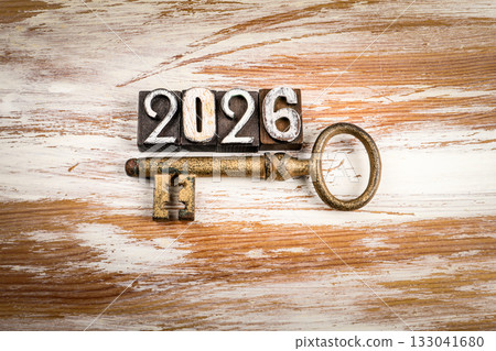 2026 made from vintage wooden letterpress blocks with antique metal key on rustic wooden background 133041680