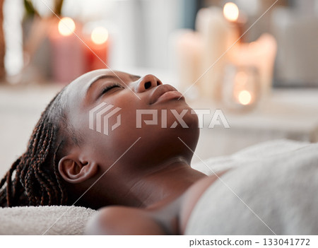 Black woman sleep, peace and luxury spa face treatment of young female ready for facial. Skincare, beauty and wellness clinic candles with client feeling calm and zen before massage or chemical peel 133041772