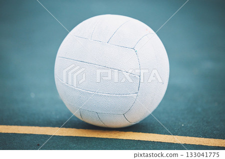 Netball on the floor on a sport court for a game, training or exercise outdoor on a field. Sports, fitness and white ball on the ground for a match, workout or practice competition by a outside arena 133041775