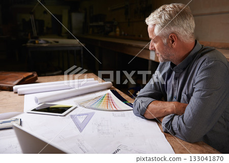 Man, senior architect and blueprint drawing in workshop, professional designer and engineering. Architecture design, floor plan paperwork on table with designing equipment and creative male engineer Man, senior architect and blueprint drawing in workshop, professional designer and engineering. Architecture design, floor plan paperwork on table with designing equipment and creative male engineer 133041870