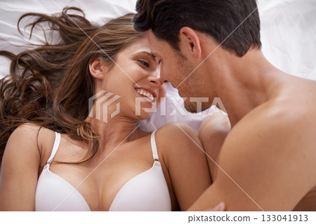Love, face smile and bedroom couple relax for morning peace, calm and quality time bonding together in Toronto Canada. Eye contact, vacation or romantic people in hotel bed for Valentines Day holiday Love, face smile and bedroom couple relax for morning peace, calm and quality time bonding together in Toronto Canada. Eye contact, vacation or romantic people in hotel bed for Valentines Day holiday 133041913