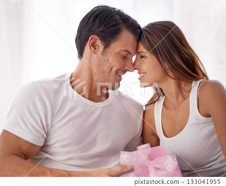 Man giving woman present, love and happy with partnership, relationship and celebration on Valentines day date. Couple smile with gift box, luxury and commitment, gratitude and celebrate holiday Man giving woman present, love and happy with partnership, relationship and celebration on Valentines day date. Couple smile with gift box, luxury and commitment, gratitude and celebrate holiday 133041955