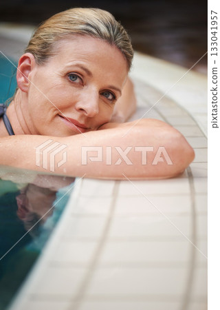 Swimming pool, portrait and woman relax on holiday, summer vacation and weekend getaway. Travel, luxury spa resort and happy female person relaxing in water for happiness, wellness and peace outdoors 133041957
