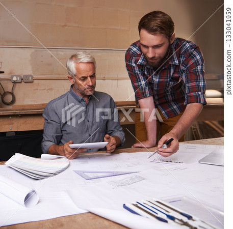Architecture men, planning and blueprint with tablet for discussion, construction or vision in workshop. Senior man, young male partner and talking with paperwork, property or real estate development Architecture men, planning and blueprint with tablet for discussion, construction or vision in workshop. Senior man, young male partner and talking with paperwork, property or real estate development 133041959