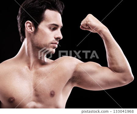 Man, bodybuilder and bicep flex in studio, black background and exercise for muscular power. Strong, sexy and topless male model, sports athlete and arm muscle for pride, training and fitness results 133041968