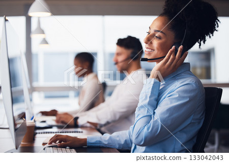 Call center, customer service and support with a black woman consultant working in her communication office. Contact us, telemarketing and consulting with a female employee at work using a headset Call center, customer service and support with a black woman consultant working in her communication office. Contact us, telemarketing and consulting with a female employee at work using a headset 133042043