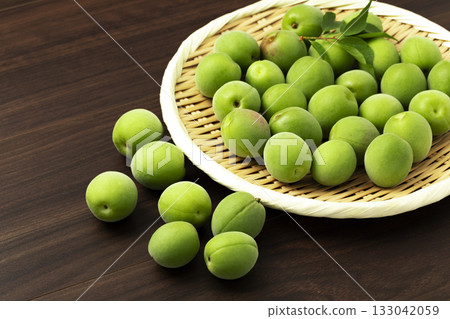 Green plums arranged in a tray Green plums arranged in a tray 133042059
