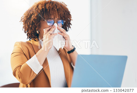 Sick, tissue and black woman with laptop in office with runny nose, allergy and virus infection at desk. Business, health problem and female worker with cold, fever and flu symptoms in workplace Sick, tissue and black woman with laptop in office with runny nose, allergy and virus infection at desk. Business, health problem and female worker with cold, fever and flu symptoms in workplace 133042077