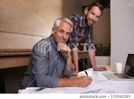Architecture, teamwork and portrait of men in workshop for collaboration on carpentry design. Senior architect, smile and father and son working on blueprint with trainee, apprentice and mentor. Architecture, teamwork and portrait of men in workshop for collaboration on carpentry design. Senior architect, smile and father and son working on blueprint with trainee, apprentice and mentor. 133042081