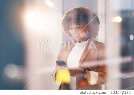 Happy, social media and black woman typing on a phone for communication, chat and connection. Smile, internet and African employee reading a message, email or text on a mobile app from a window Happy, social media and black woman typing on a phone for communication, chat and connection. Smile, internet and African employee reading a message, email or text on a mobile app from a window 133042123