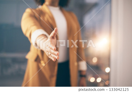 Business woman stretching her hand for a handshake for greeting, welcome or partnership in office. Company, corporate and female employee with shaking hands gesture for agreement in modern workplace. Business woman stretching her hand for a handshake for greeting, welcome or partnership in office. Company, corporate and female employee with shaking hands gesture for agreement in modern workplace. 133042125