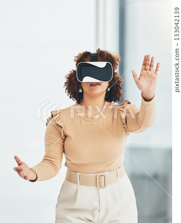 Virtual reality, metaverse and business woman in the office planning a digital project with a headset. VR, 3d and professional female employee designing a graphic company report in the workplace. Virtual reality, metaverse and business woman in the office planning a digital project with a headset. VR, 3d and professional female employee designing a graphic company report in the workplace. 133042139