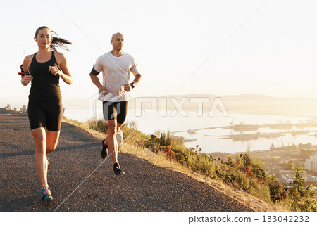 Morning, fitness and couple running as exercise or workout for health and wellness together in sunrise. Sport, man and woman runner run with athlete as training listening to sports music for energy 133042232