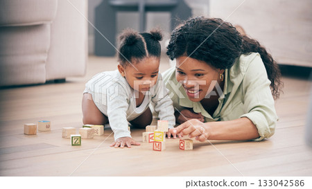 Baby, mother and toy building blocks for child knowledge development on living room floor. Family home, teaching and mom with girl toddler learning and helping with happiness and a smile with love Baby, mother and toy building blocks for child knowledge development on living room floor. Family home, teaching and mom with girl toddler learning and helping with happiness and a smile with love 133042586