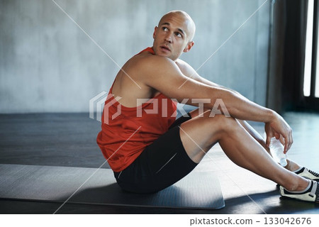 Workout, looking and man relax on floor after health club exercise, sports commitment or gym training. Tired breathing, thinking man and healthy person sitting after cardio, fitness or challenge Workout, looking and man relax on floor after health club exercise, sports commitment or gym training. Tired breathing, thinking man and healthy person sitting after cardio, fitness or challenge 133042676