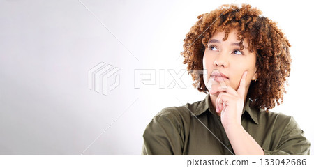 Face, thinking and mockup with a black woman in studio on a gray background for product placement. Idea, space and mock up with an attractive young female posing on a wall of empty branding space Face, thinking and mockup with a black woman in studio on a gray background for product placement. Idea, space and mock up with an attractive young female posing on a wall of empty branding space 133042686