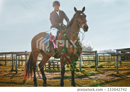Woman, equestrian winner portrait and pet horse in green countryside and field. Animal, young jockey win an award at competition or show of a rider and athlete with outdoor with sports with horses Woman, equestrian winner portrait and pet horse in green countryside and field. Animal, young jockey win an award at competition or show of a rider and athlete with outdoor with sports with horses 133042742