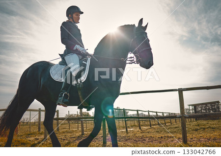 Woman, equestrian, pet horse ride and mockup in nature on countryside grass field. Animal training, young jockey and farm of a rider and athlete with mock up outdoor doing saddle sports with horses 133042766