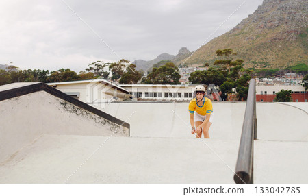 Skating, sports and fun with a woman athlete at a skatepark for recreation or leisure during summer. Fitness, health or energy and a young female skating outdoor at speed with balance and skill Skating, sports and fun with a woman athlete at a skatepark for recreation or leisure during summer. Fitness, health or energy and a young female skating outdoor at speed with balance and skill 133042785