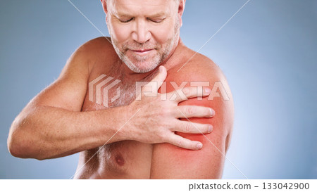 Senior man, arm pain and red glow on muscle or body on a blue background in studio with arthritis. Elderly model person with hand on injury, anatomy health problem or broken bone medical risk Senior man, arm pain and red glow on muscle or body on a blue background in studio with arthritis. Elderly model person with hand on injury, anatomy health problem or broken bone medical risk 133042900