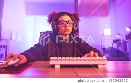 Computer video game, girl and live streaming in home for esports, online games and virtual competition. Female gamer, headphones and gaming with headset in neon lighting, cyber tech or gen z streamer Computer video game, girl and live streaming in home for esports, online games and virtual competition. Female gamer, headphones and gaming with headset in neon lighting, cyber tech or gen z streamer 133043222