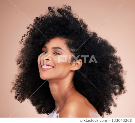 Black woman, afro hair or skincare glow on studio background in empowerment pride, curly texture or healthy growth. Beauty model, happy or natural hairstyle and makeup aesthetic on isolated spa wall 133043268