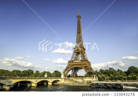 PARIS, FRANCE - JUNE 20 2024: The Olympic Rings installed on the Eiffel Tower ahead of the Paris 2024 Olympic Games 133043278