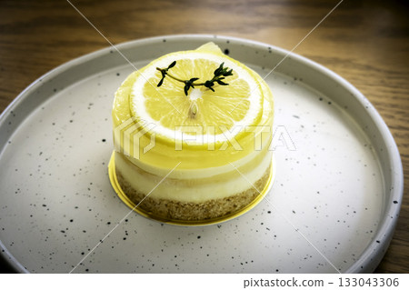 Closeup of a homemade lemon tart decorated and lime slices Closeup of a homemade lemon tart decorated and lime slices 133043306