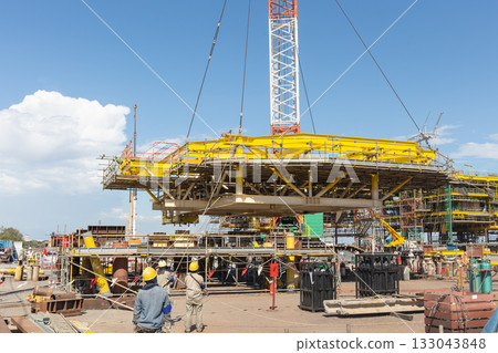 Offshore platform under construction with crane. 133043848