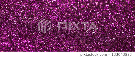 Purple sparkling background from small sequins, macro. Shiny magenta glitter backdrop for Christmas or New Year 133043883
