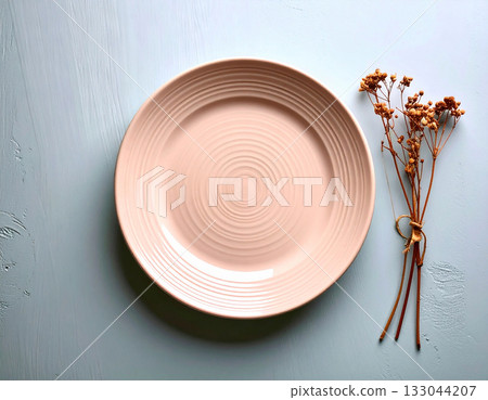 Classic tableware. Ceramic plate with a classic pink design on a white background. Porcelain kitchenware. Close-up. Top view. Classic tableware. Ceramic plate with a classic pink design on a white background. Porcelain kitchenware. Close-up. Top view. 133044207