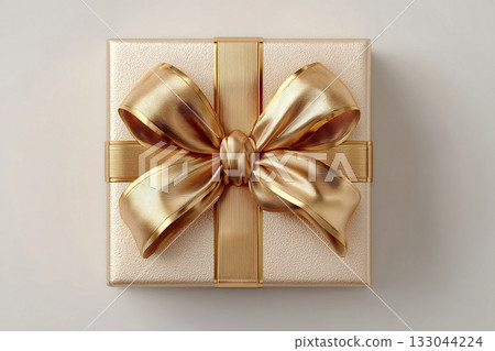 Packaging design. Gold box wrapped with a bow on white background. Jewelry, birthdays, Christmas and luxury branding. 133044224