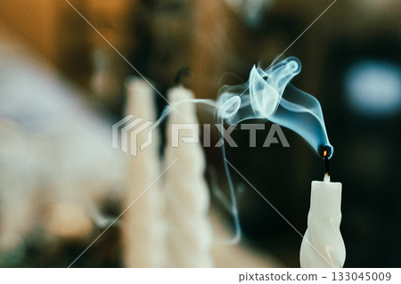 Smoke Rising from Extinguished Candle Closeup Smoke Rising from Extinguished Candle Closeup 133045009