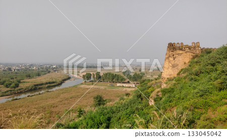 River flowing beside the historic Rohtas Fort wall 133045042