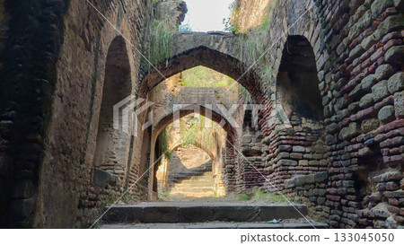 Well preserved Sat Baoli of Rohtas Fort showing ancient arches and stone stairs 133045050