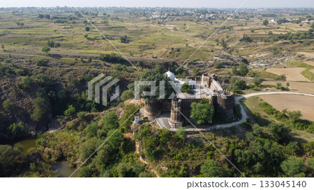 Aerial drone shot of Sangni Fort highlighting Mughal heritage surrounded by forest and agricultural village landscape Aerial drone shot of Sangni Fort highlighting Mughal heritage surrounded by forest and agricultural village landscape 133045140