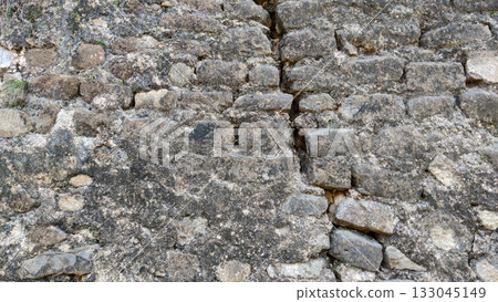 Old wall crack showing signs of age and structural stress 133045149