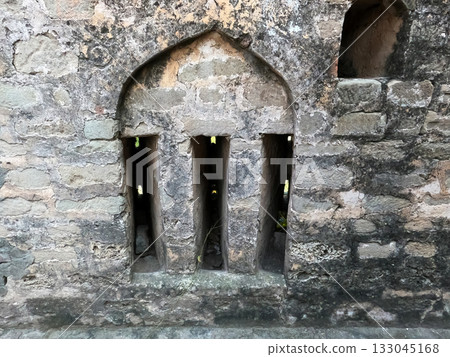 Ancient defensive wall of Sangni Fort showing observation holes used for protection and military watch in old times Ancient defensive wall of Sangni Fort showing observation holes used for protection and military watch in old times 133045168