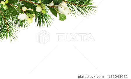 Snowberries (Symphoricarpos albus) with green leaves and twigs of Christmas tree in a corner arrangement  isolated on white 133045681