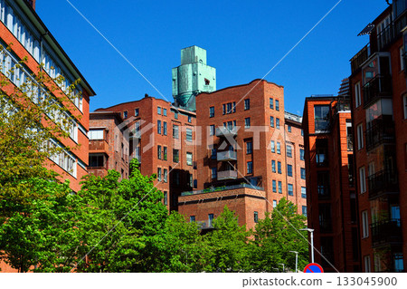 Houses in Eriksberg district, former shipyard near Alvsborg bridge, Hisingen island, sunny day in Gothenburg, Sweden Houses in Eriksberg district, former shipyard near Alvsborg bridge, Hisingen island, sunny day in Gothenburg, Sweden 133045900