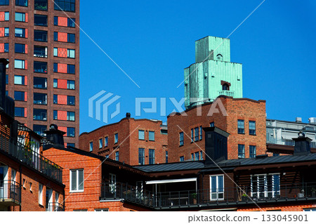 Houses in Eriksberg district, former shipyard near Alvsborg bridge, Hisingen island, sunny day in Gothenburg, Sweden 133045901