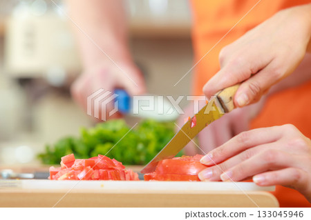 Couple preparing fresh vegetables food salad 133045946