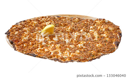 A lahmacun with a slice of lemon on top 133046040
