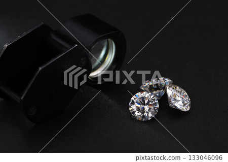 Three diamonds are on a black background Three diamonds are on a black background 133046096