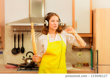 Dancing housewife in kitchen Dancing housewife in kitchen 133046127