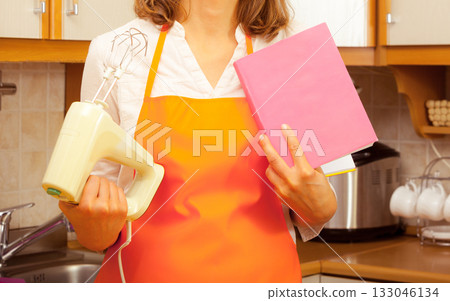 Housekeeper with cookbook and mixer 133046134