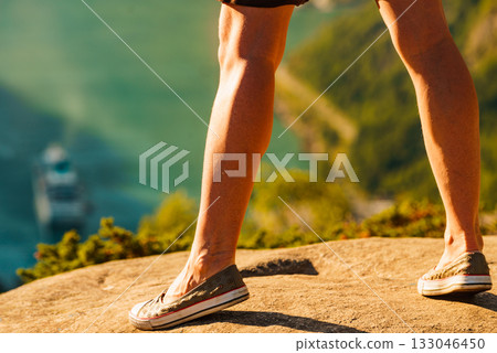 Tourist legs on viewpoint in Norway 133046450