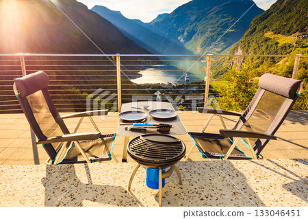 Dinner table with grill on norwegian nature 133046451