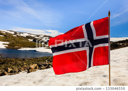 Norwegian flag and mountains snowy landscape Norwegian flag and mountains snowy landscape 133046550